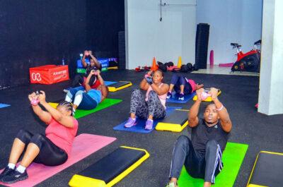 Members stretching during a group fitness class at Zoezi